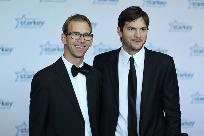 Michael Kutcher and brother Ashton Kutcher walk a red carpet together