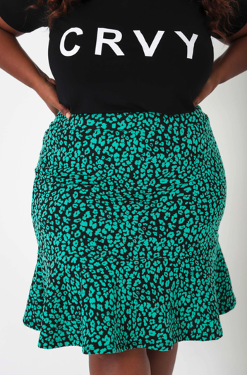 model wearing the teal and black leopard print skirt