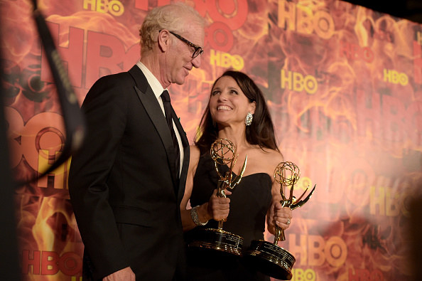 Brad and Julia, who&#x27;s holding two awards, on the red carpet