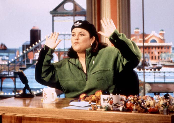 Rosie sits at her desk on her old talk show