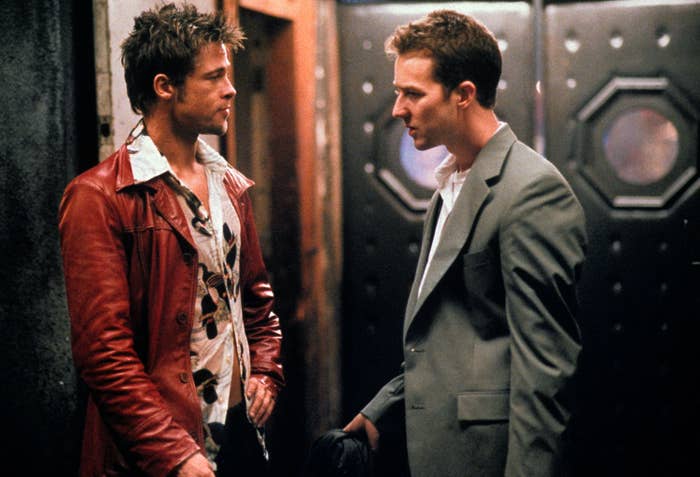 Brad Pitt and Edward Norton look at each other in a photo from Fight Club