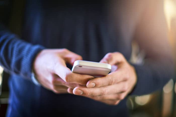 A man holding an iPhone