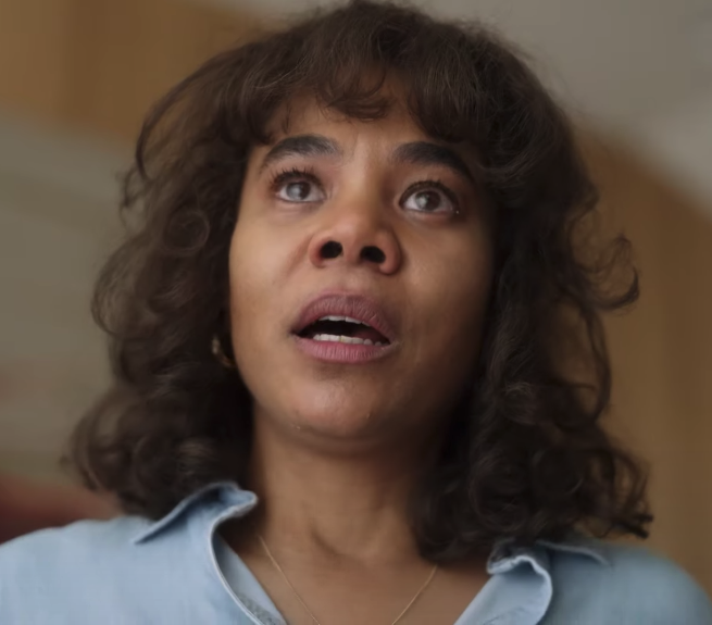 A close up of a character with tears in her eyes