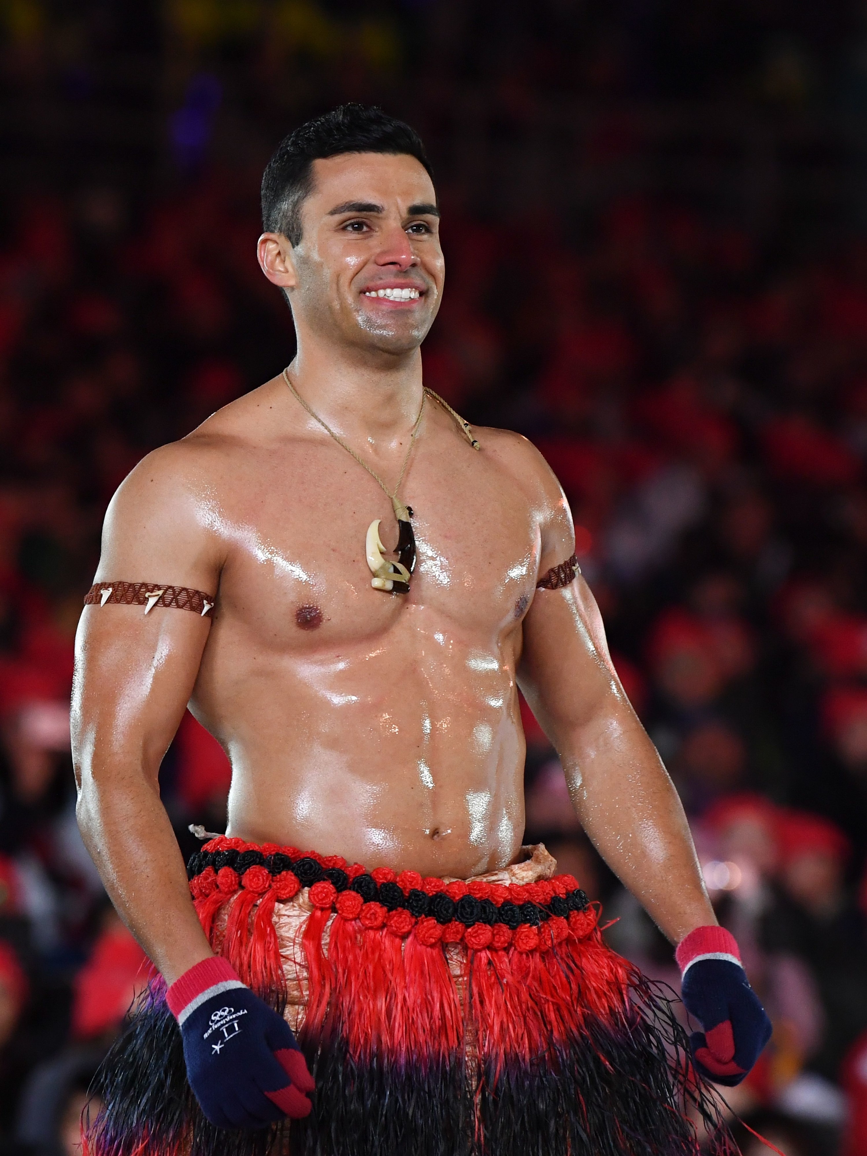 Pita Taufatofua is seen with an oily, muscled chest