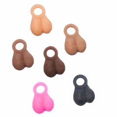 Assortment of realistic-looking scrotum attachments in skin tone hues, pink and black