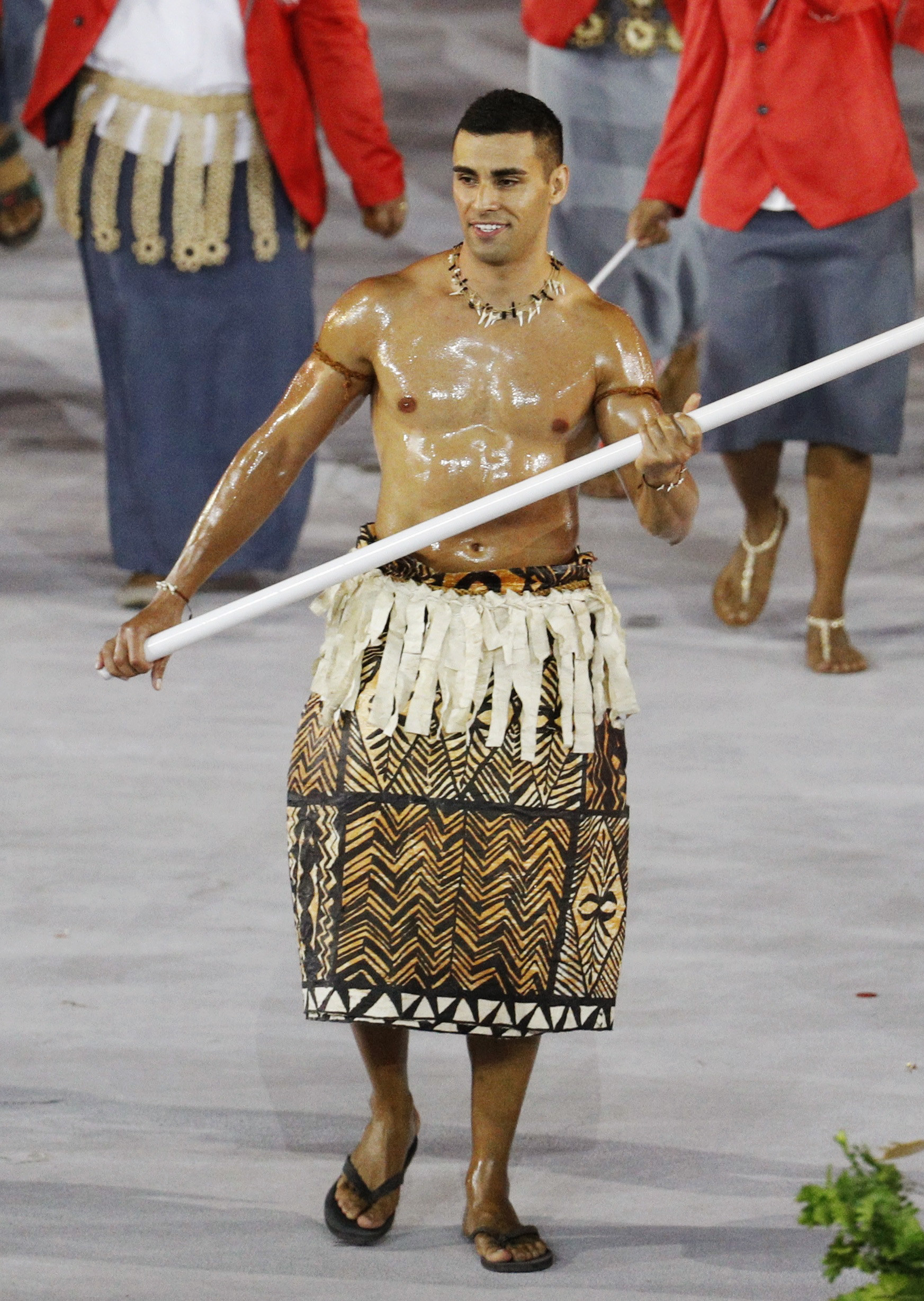 Pita Taufatofua is seen with an oily, muscled chest