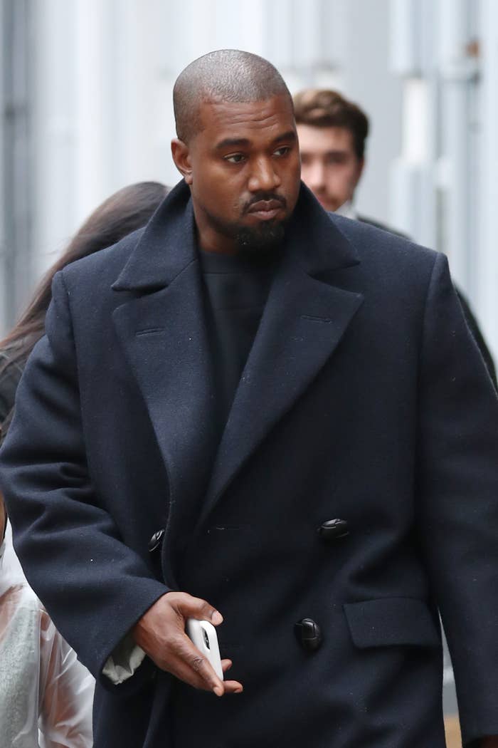 Kanye West is pictured walking outside in London