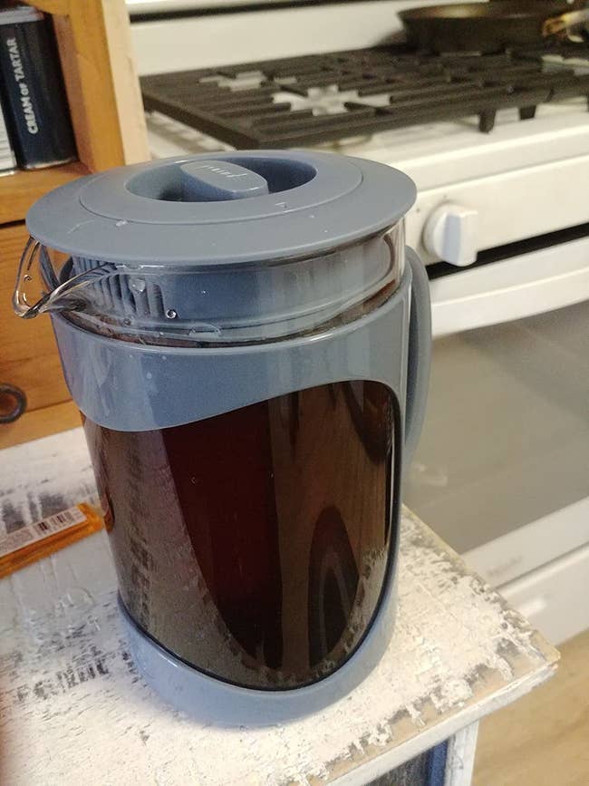 reviewer image of the blue primula cold brew maker full of cold brew