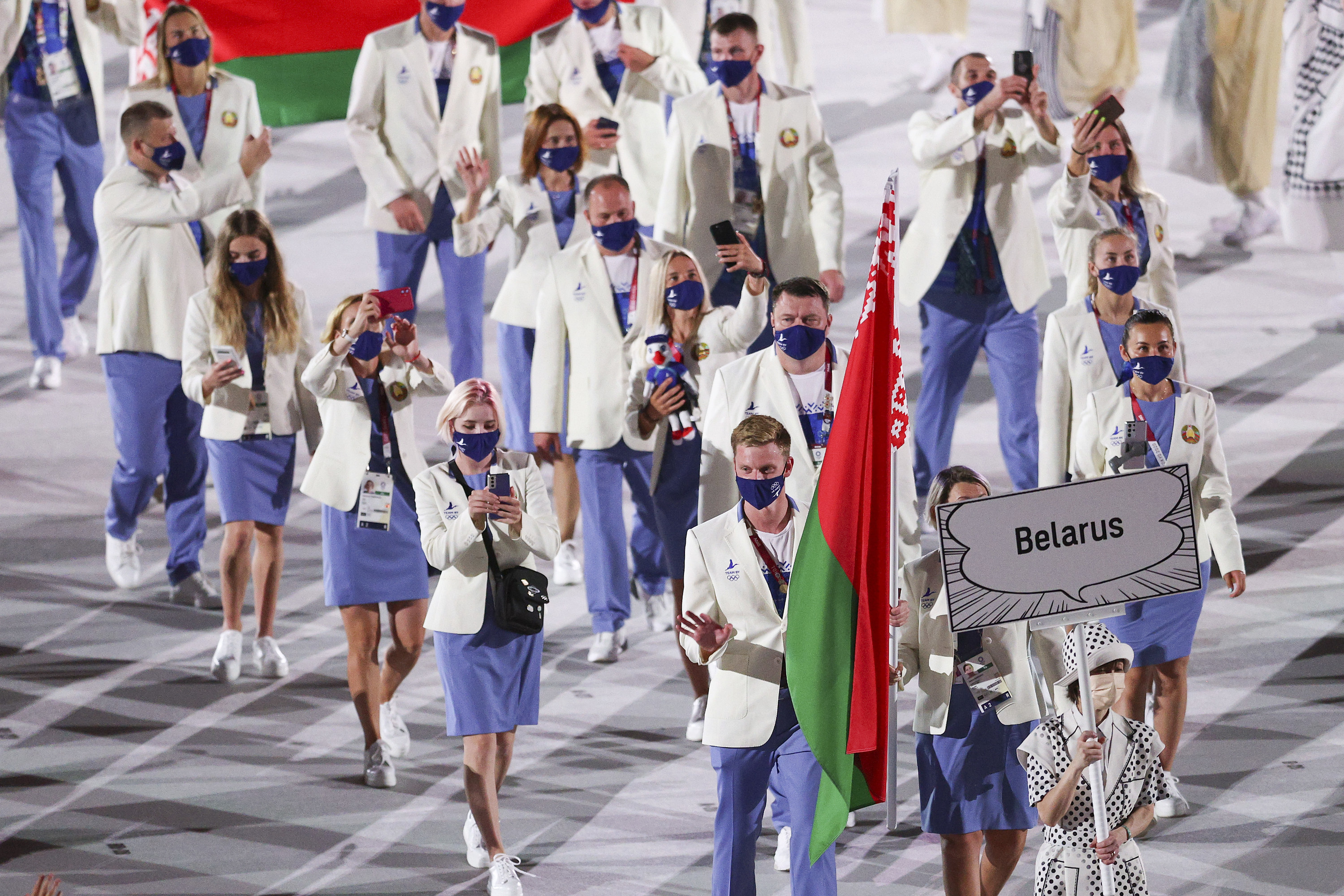The athletes wore light blazers and pastes pants or skirts with sneakers