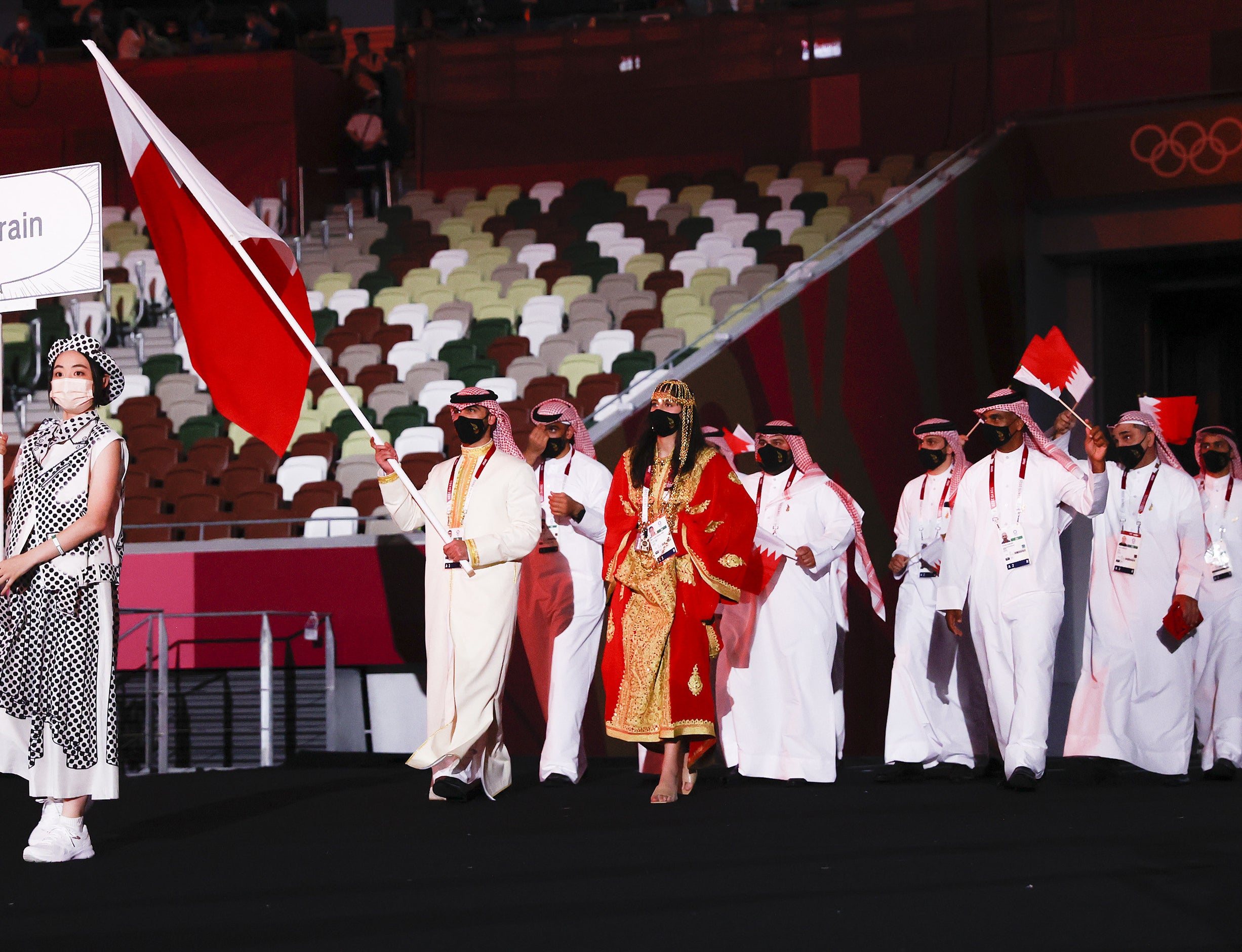 The athletes wore traditional abayas, long gowns with a hijab or thobes, long gowns traditionally worn by men