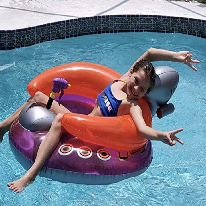kid laying in UFO float