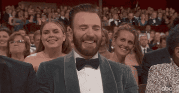 Chris laughing at the Oscars
