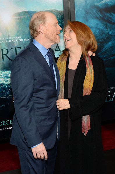 Ron Howard and Cheryl looking at each other on the red carpet