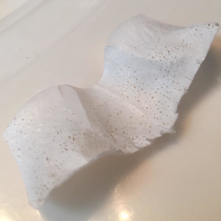A customer review photo showing the residue left on a used strip
