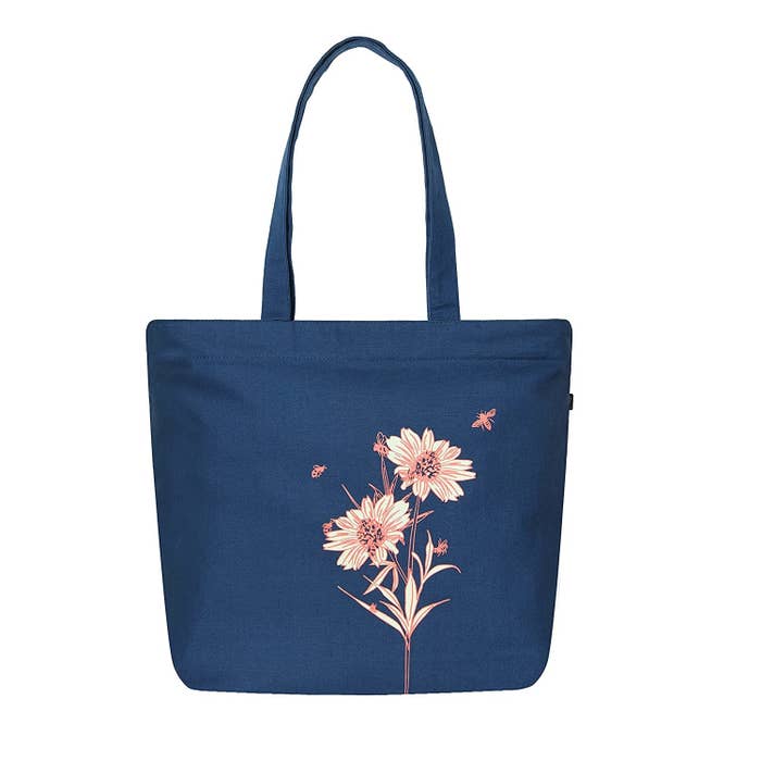 A dark blue tote bag with flowers on it