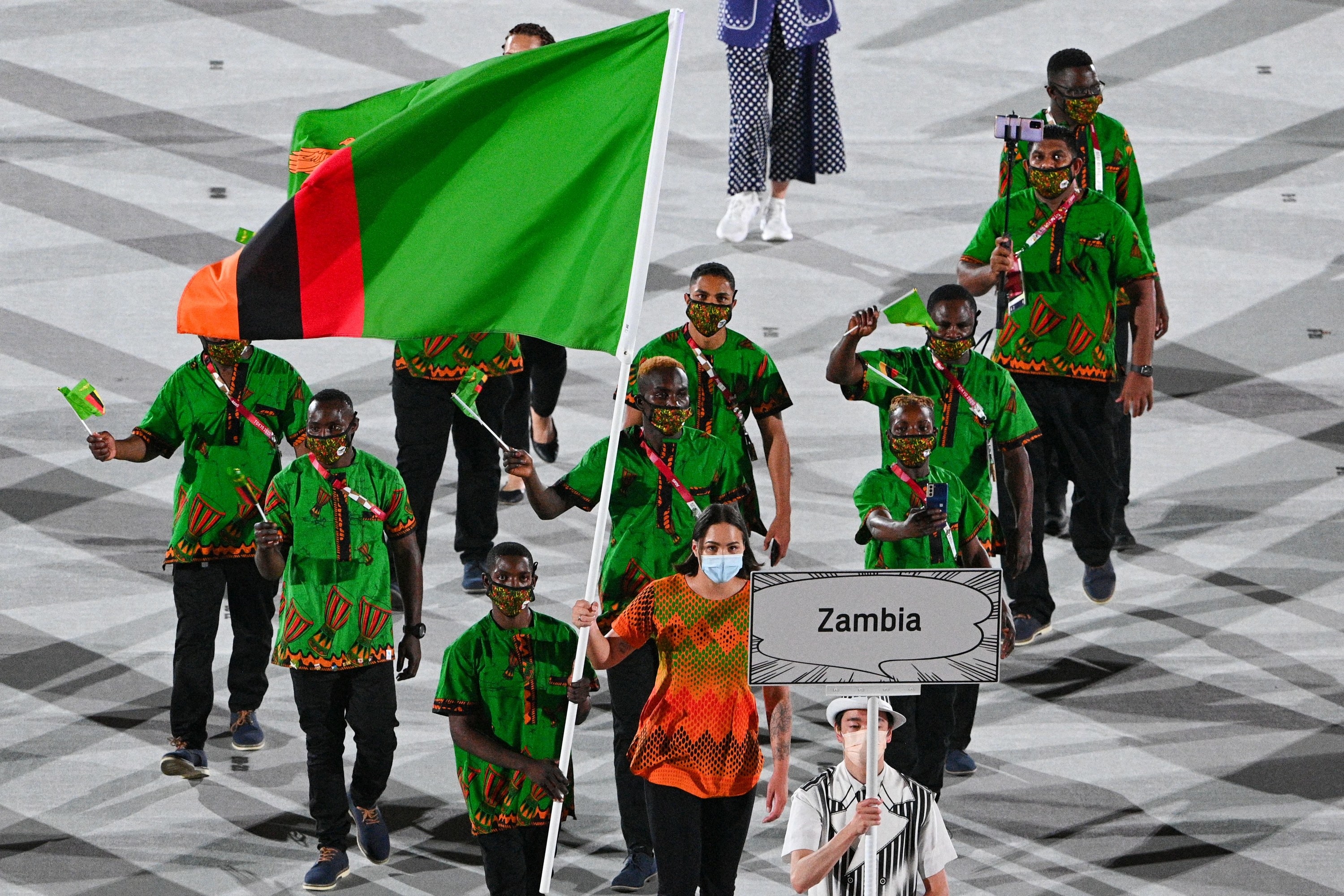 The Zambian athletes wore printed loose fitting tops and dark pants
