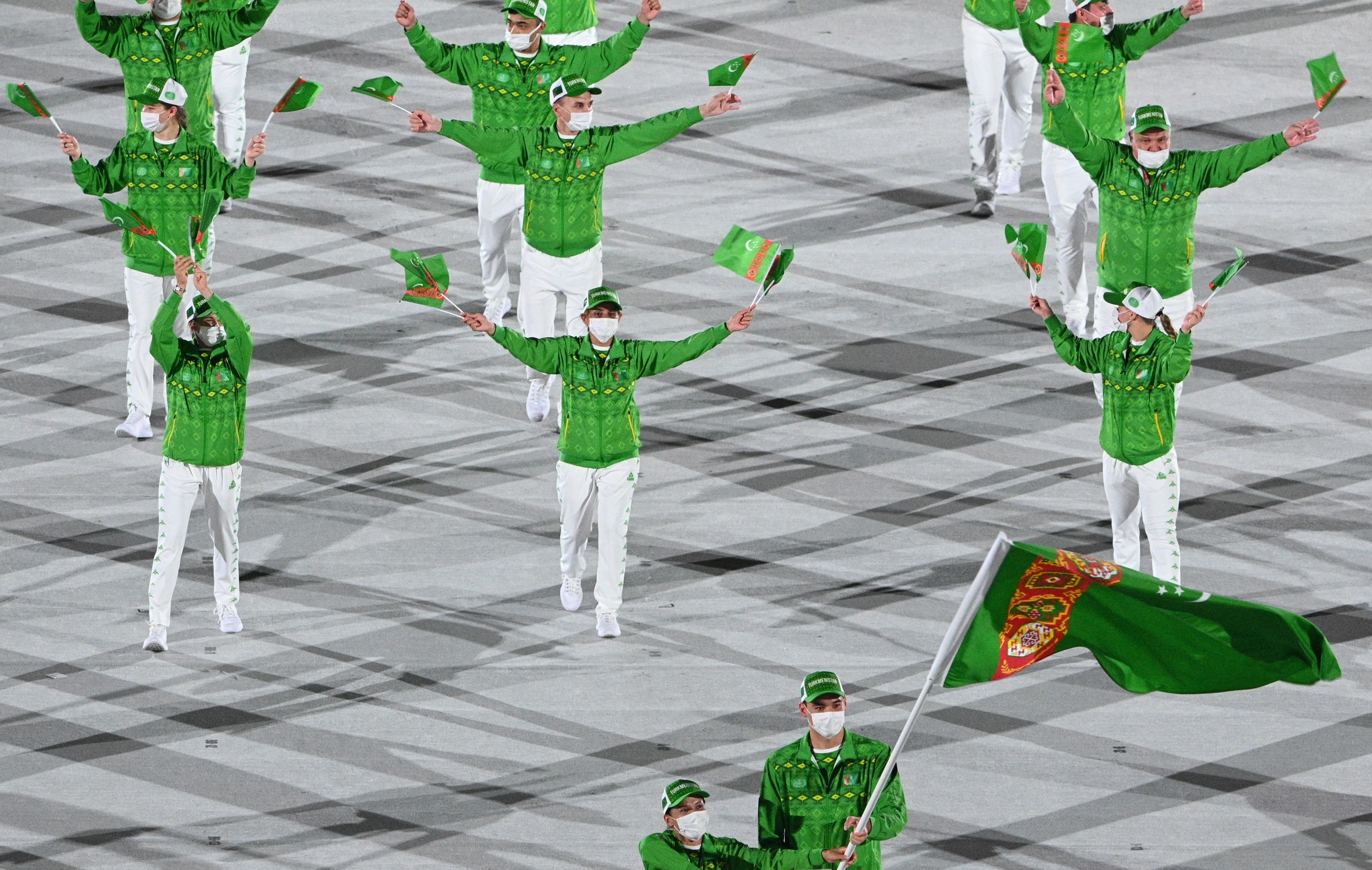 The athletes wore tracksuits to match their flag