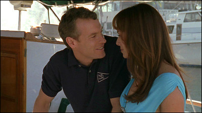 julie and jimmy on a boat, about to kiss