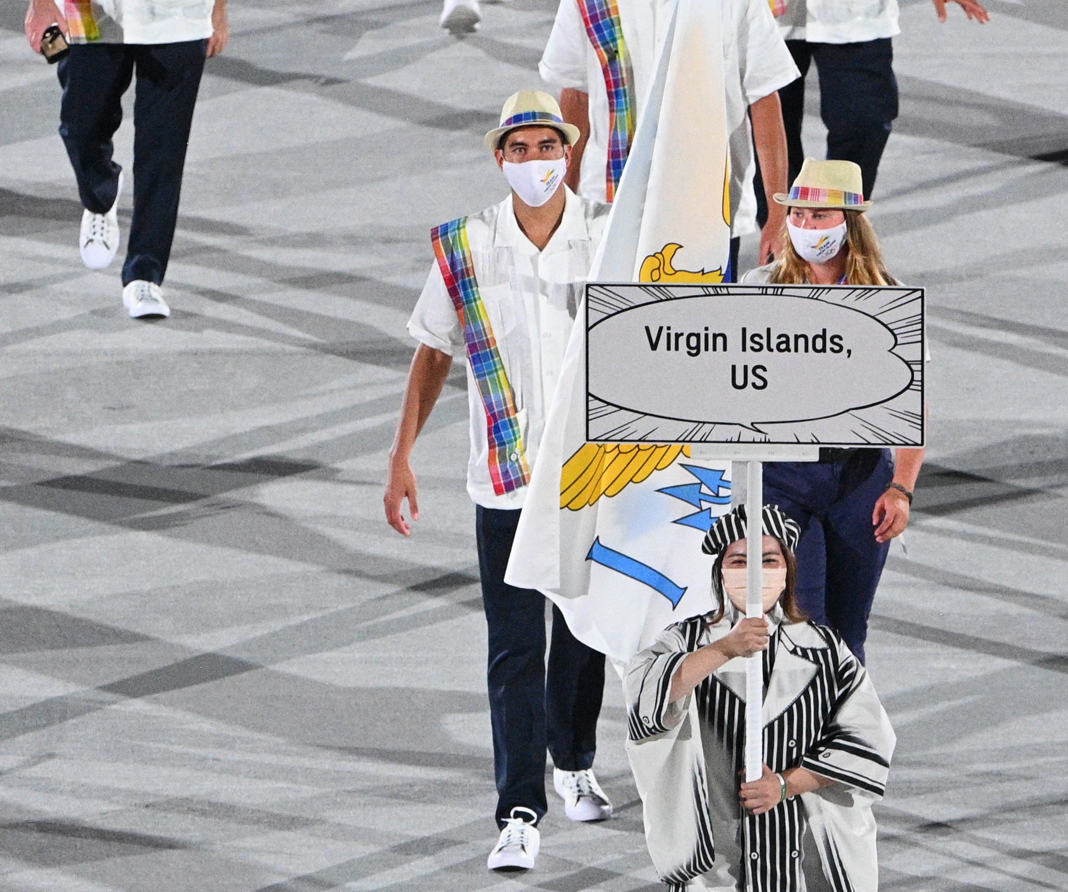 The athletes wore loose fitting shirts with plaid detailing and matching fedoras