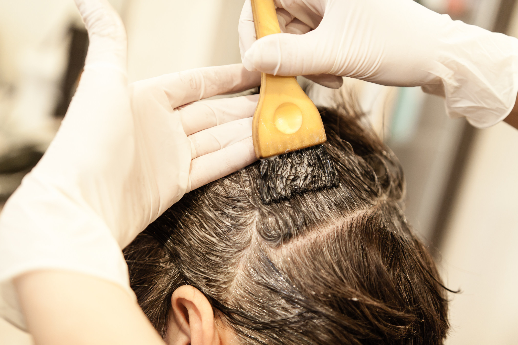 Woman getting her hair dyed