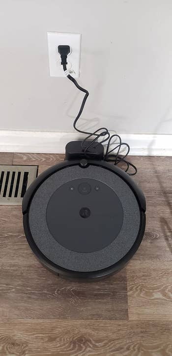 Reviewer photo of the Roomba in its charging dock