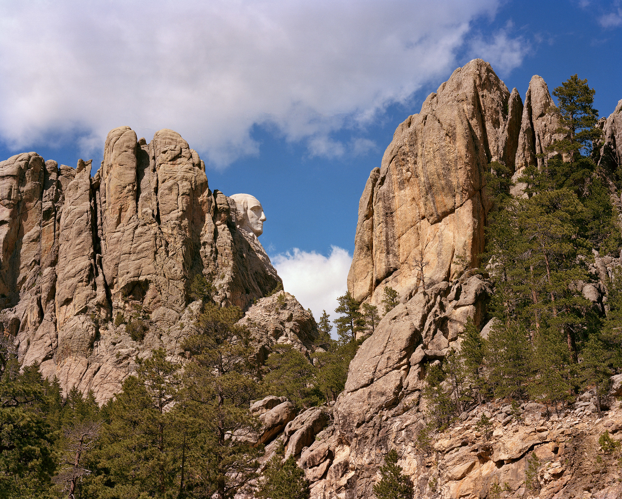 The face of George Washington appears in profile in the red rock