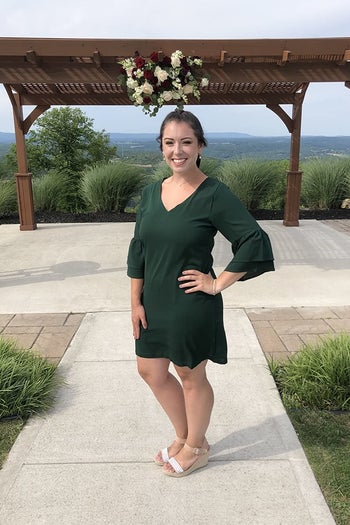 another reviewer wearing the dress in green with wedges 