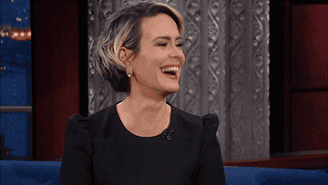 Sarah Paulson nods and cracks up, clapping her hands