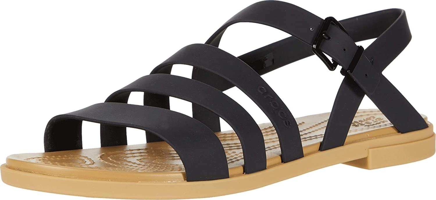 A Crocs strappy sandal in black with a beige base