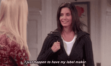 Gif of Monica Geller pulling a label maker out of her bag