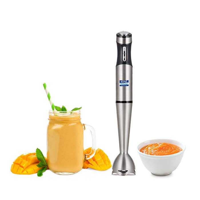 A stainless steel hand blender from Kent with mango juice and sauce kept beside it