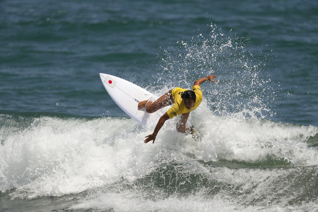 Mahina riding a crashing wave