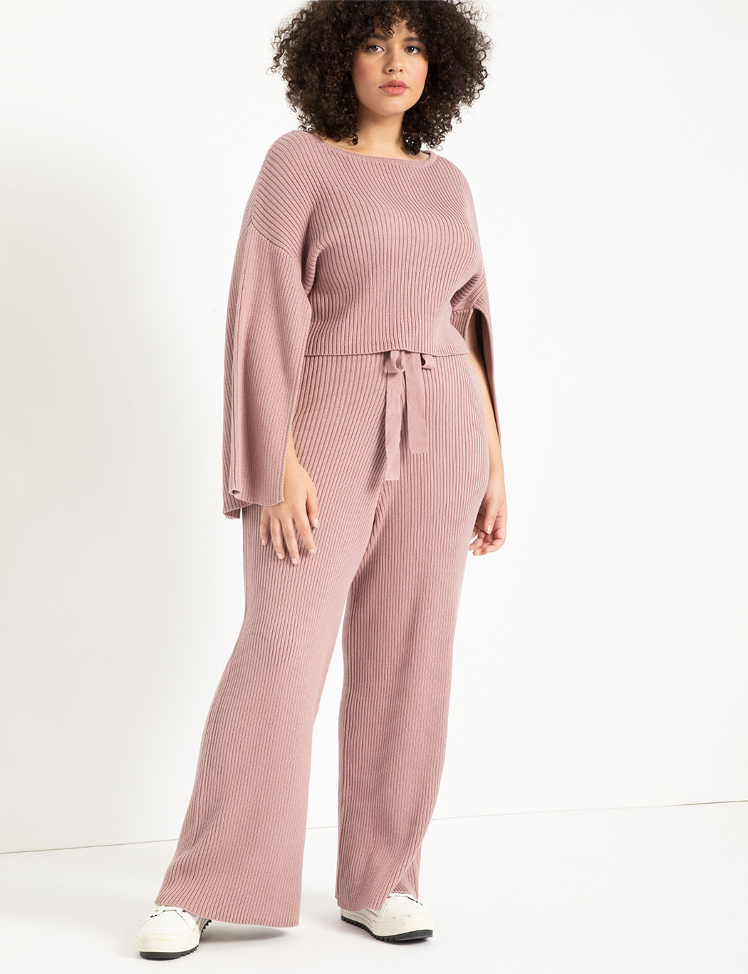 model wearing blush pink wide-leg sweater pants