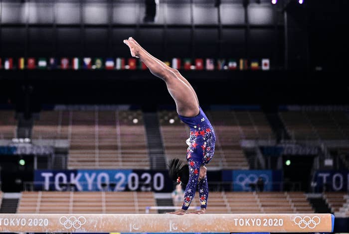 Simone Biles is pictured doing a beam routine during the women's qualifying rounds at the 2020 Tokyo Olympic Games