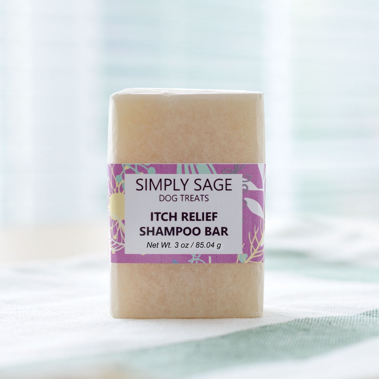 The bar of soap with a label that says &quot;Itch Relief Shampoo Bar&quot; and the shop name