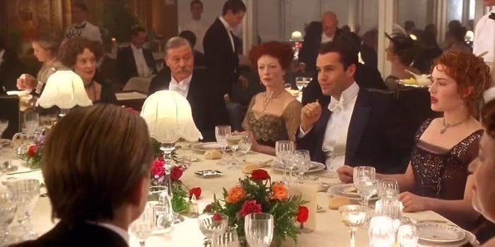 A scene from the movie Titanic showing Rose and other passengers at the dinner table