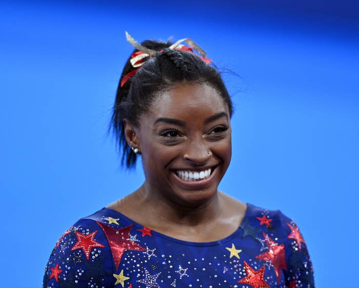 Simone Biles is pictured smiling during the artistic gymnastic women&#x27;s qualifying rounds at the Tokyo 2020 Olympic Games