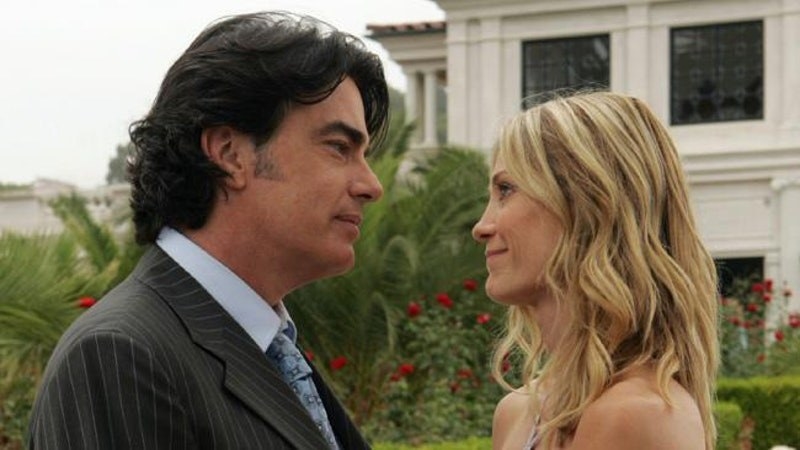 sandy and kirsten look into each other's eyes