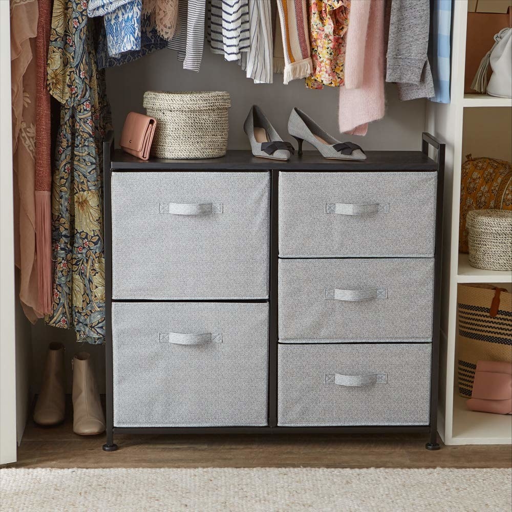 A 5-drawer storage unit placed in a wardrobe