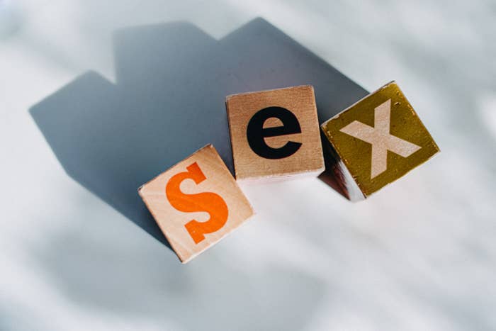 An image of &quot;sex&quot; spilled out with letter blocks on a white background