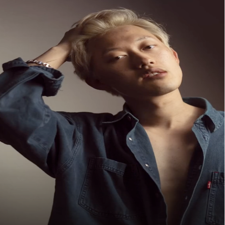 David posing with his shirt very unbuttoned