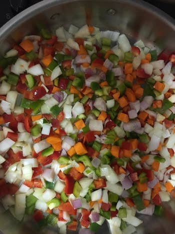 a reviewer's pan of chopped vegetables