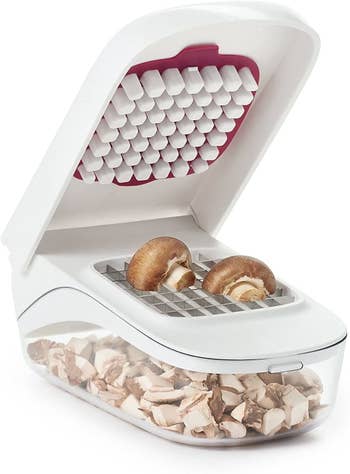 the white oxo chopper with mushrooms chopped in the base