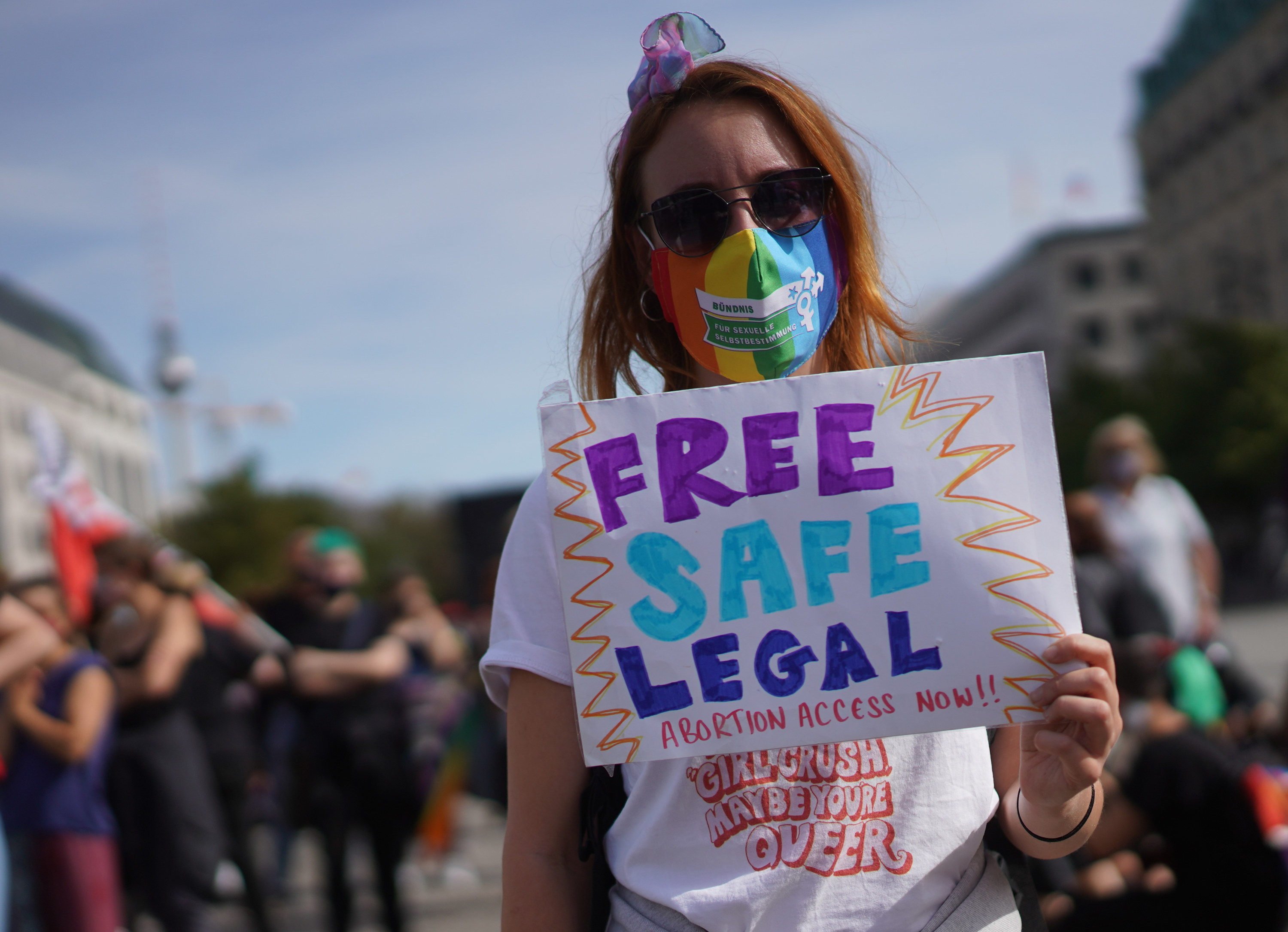 An image of a sign from a march reading, &quot;Free, Safe, Legal Abortion Access Now&quot;