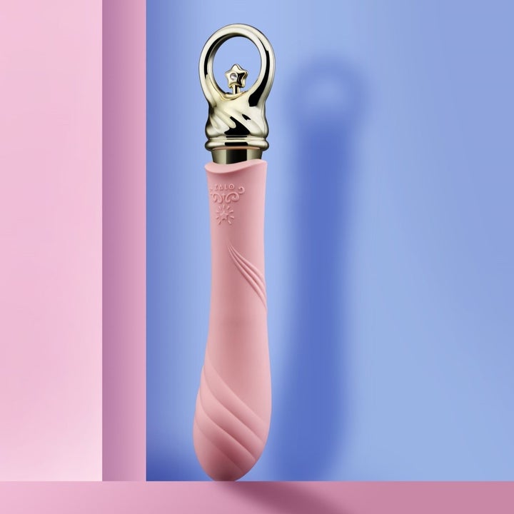Pink and goldtone vibrator