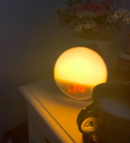 A customer review photo of the alarm clock on their nightstand