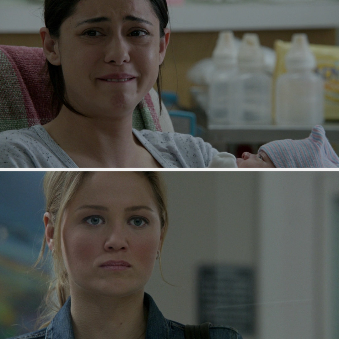 Julia looking upset as she sees Zoe holding the baby and crying