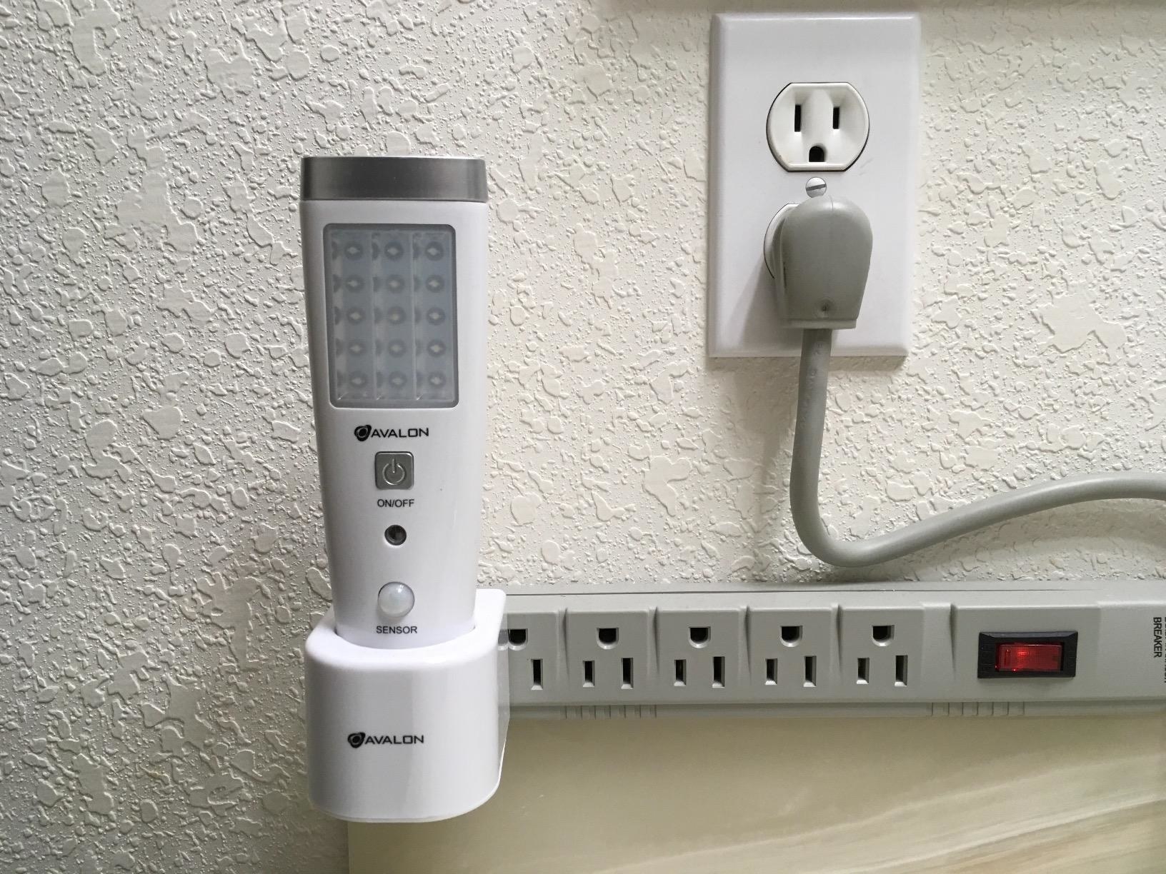 reviewer photo of the night light plugged into power strip