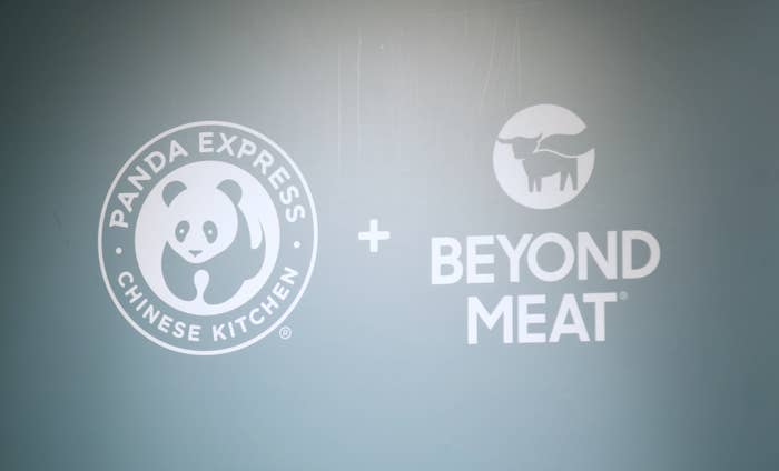 The Panda Express logo and the Beyond Meat logo on a wall