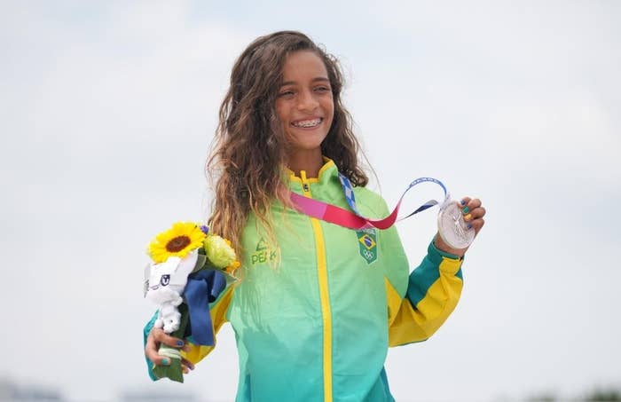 Rayssa smiling and posing with her medal